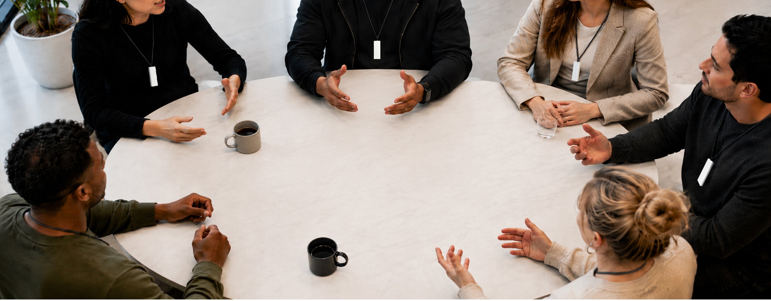 FAQ page showing Professionals wearing Echo AI note takers discussing something