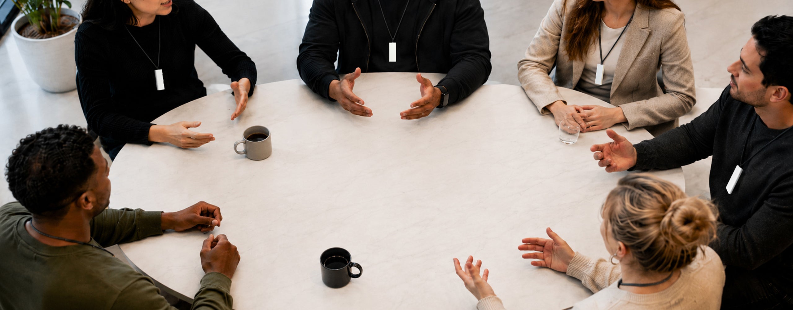 FAQ page showing professionals wearing Echo AI note takers discussing something