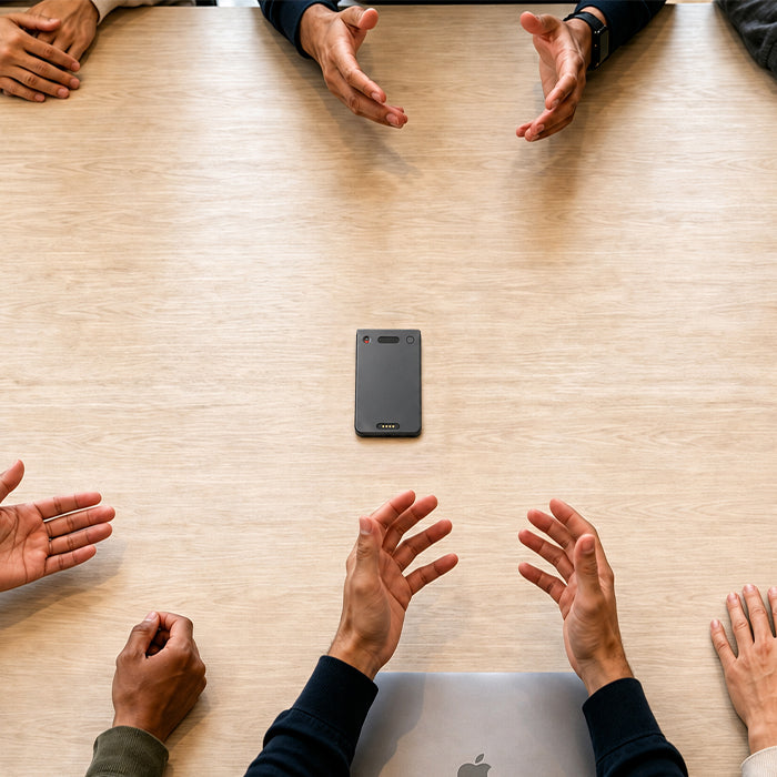 Echo Pro AI note taker on a table for recording a business meeting