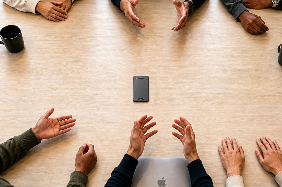 Echo Pro AI note taker on a table for recording a business meeting